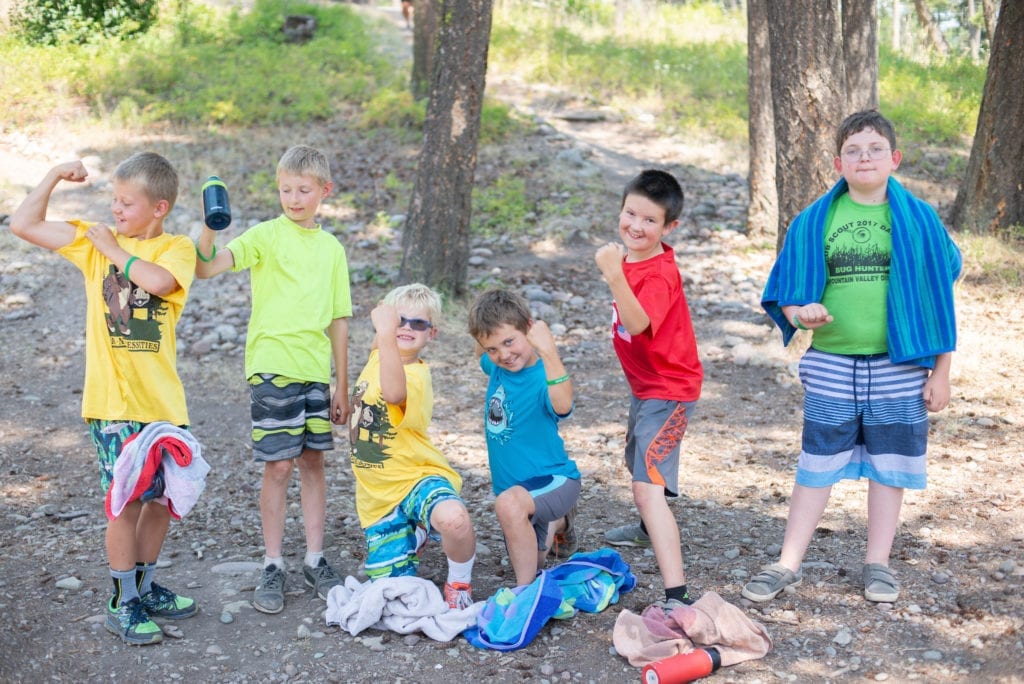 Six Boy Scouts smile and have fun at Webelos summer camp in Montana.