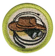 Exploration merit badge for Boy Scouts, featuring adventure gear like binoculars